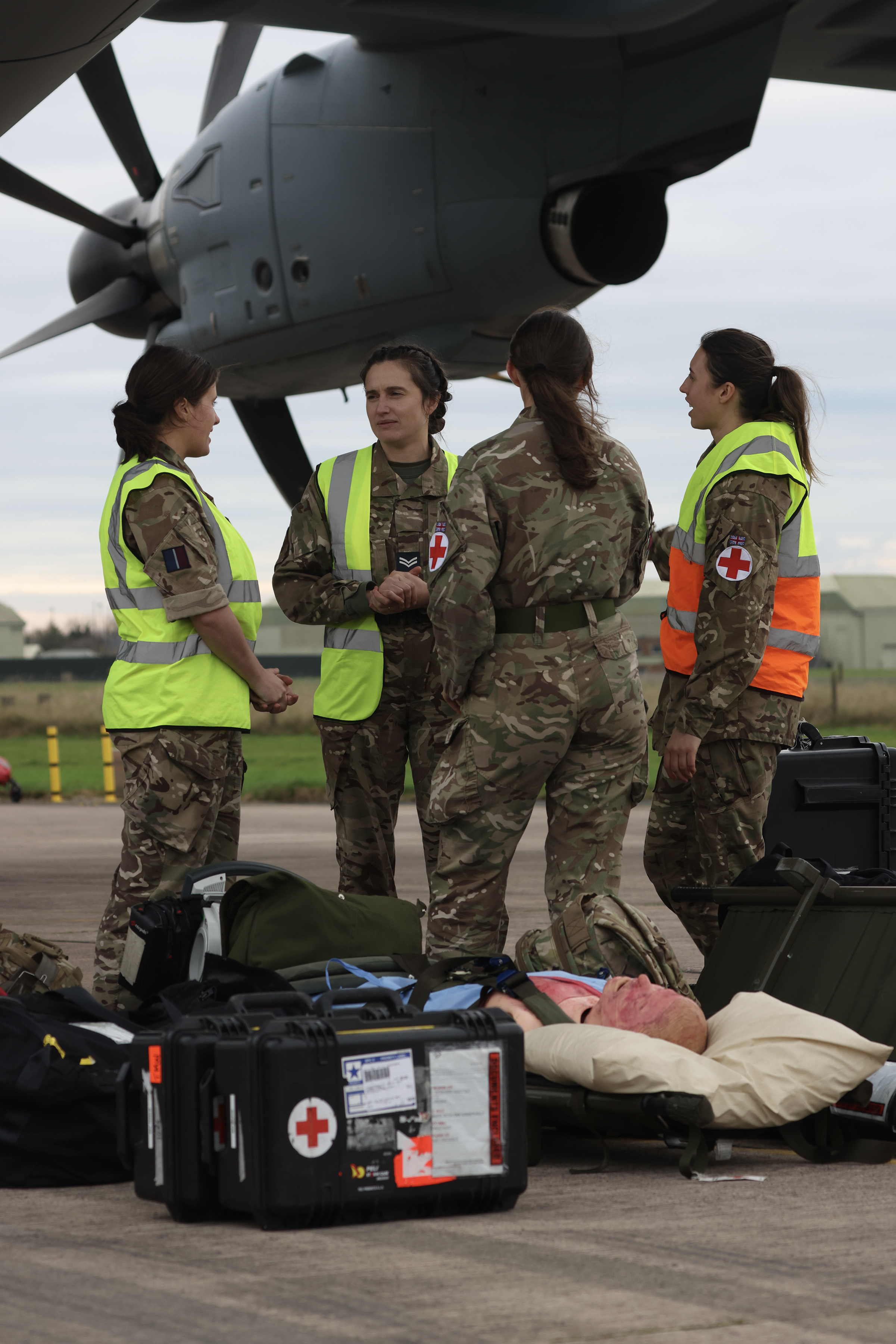 Photo: Image showing Exercise Venture Spirit medical personnel With their equipment, standing under the starboard wing of an Atlas C Mk. 1 (A400M)